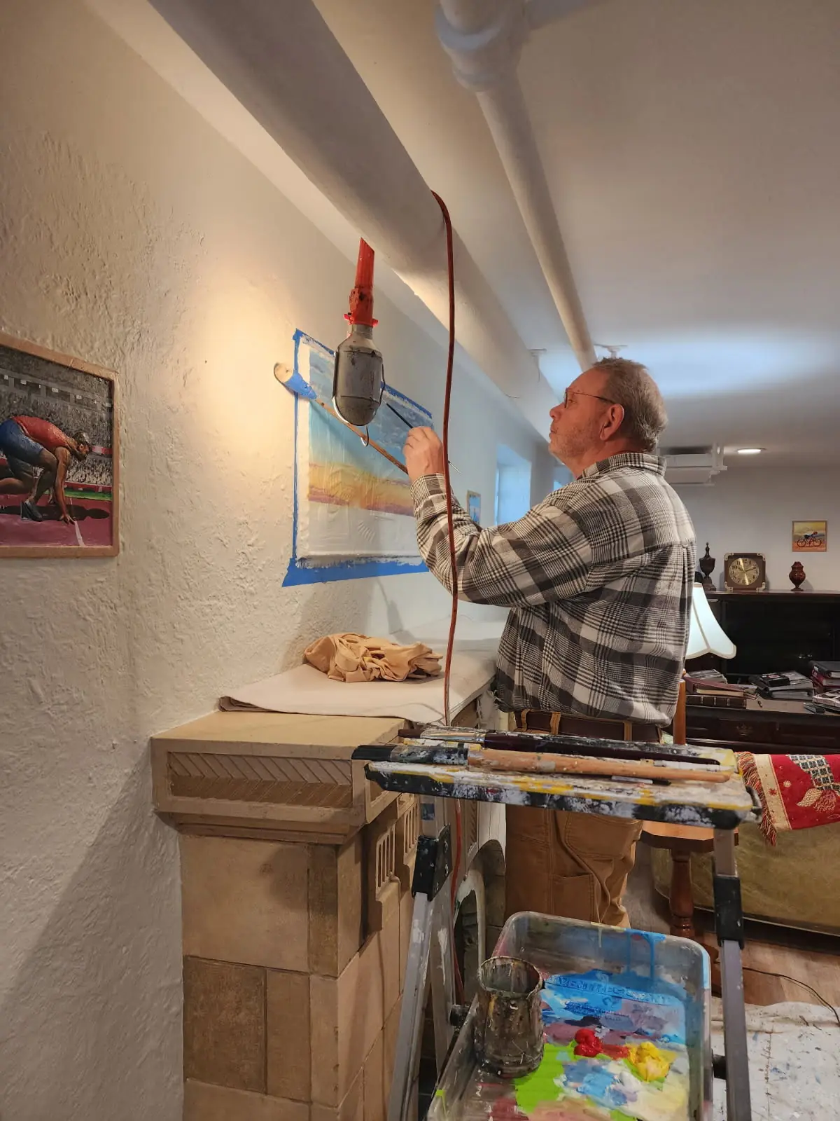 John Sames at his easel in a client's family room